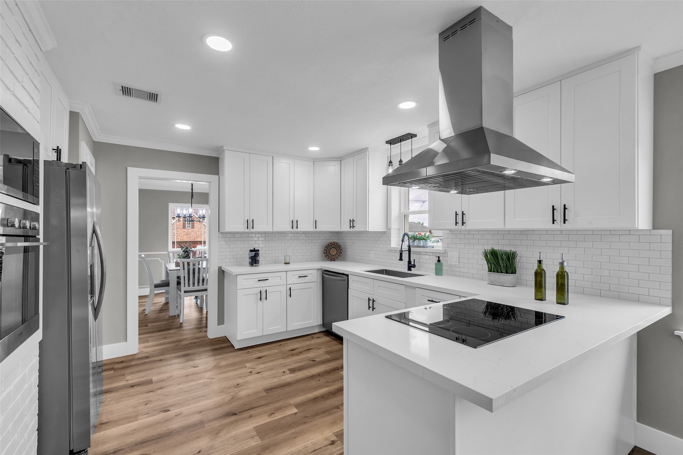 3518 Shore Shadows Drive Crosby, TX 77532 - Photo 8 of 42 a kitchen with a stove a sink and a refrigerator