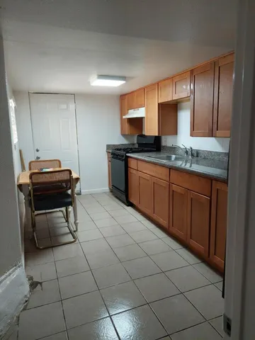 a kitchen with stainless steel appliances a sink and a counter top space