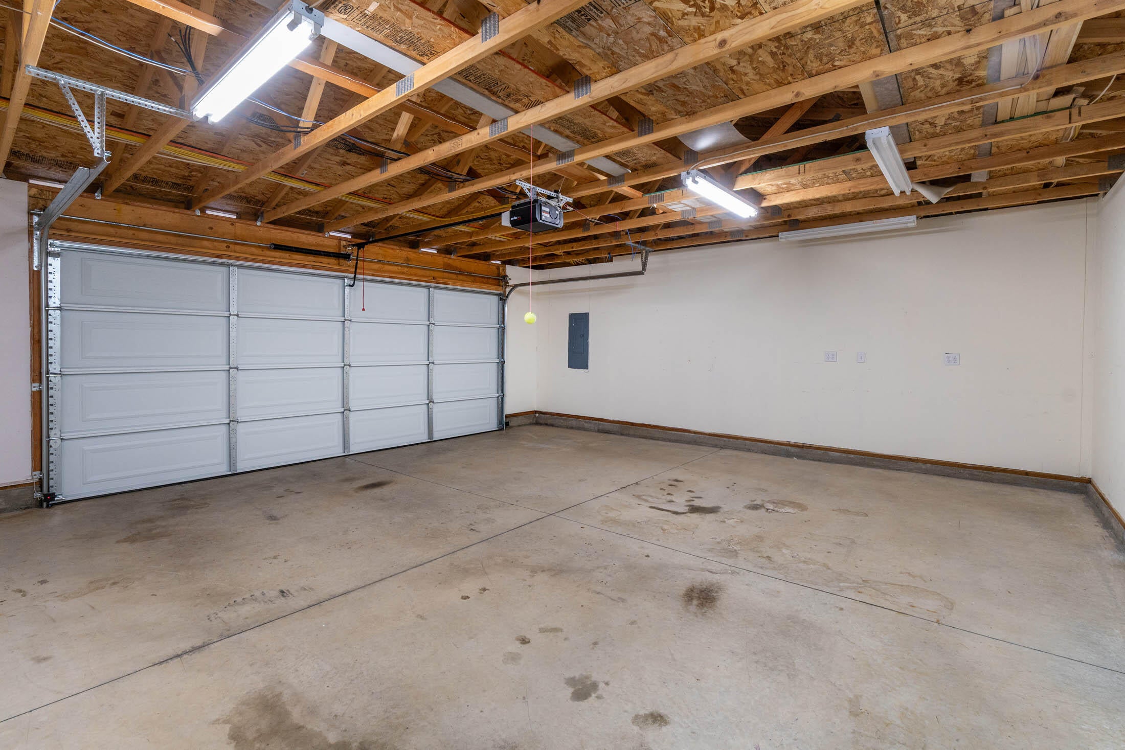 60196 Navajo Road Bend, OR 97702 - Photo 16 of 23 Large double garage has new overhead door, automatic opener, and sheetrocked walls. There is also a man-door to the back yard.