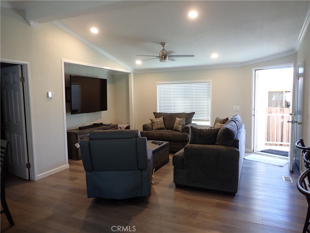 27250 Murrieta Road, Unit 386 Menifee, CA 92586 - Photo 5 of 32 a living room with furniture and a flat screen tv