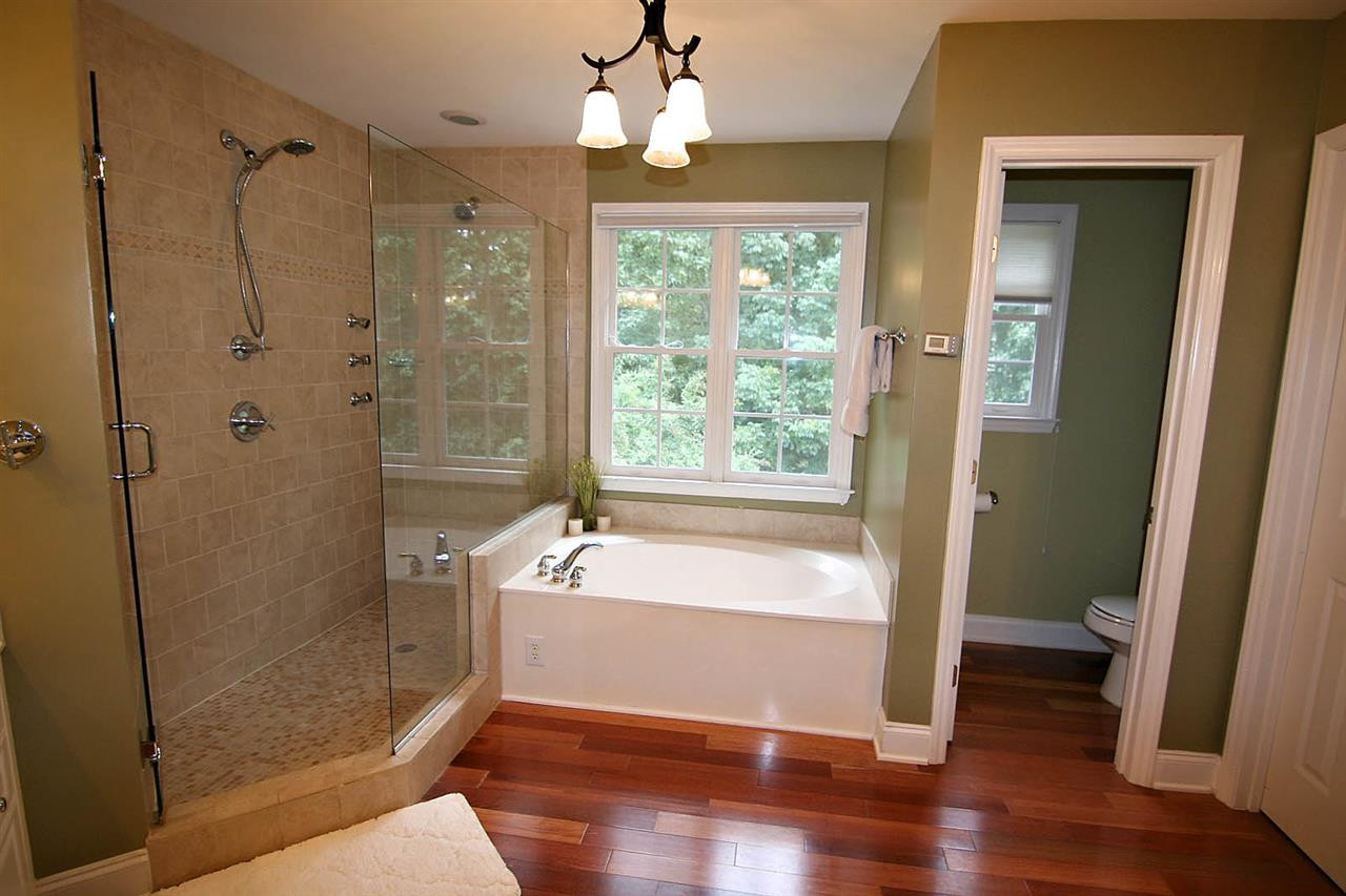 4109 Batiste Road Raleigh, NC 27613 - Photo 15 of 25 Master Bathroom has Dual Vanities, and a LUXURY Shower with a Bench and Three Zones including Dual Shower Heads, and Body Sprays. Master Bathroom