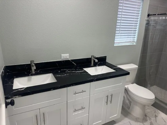 a bathroom with a sink and a toilet