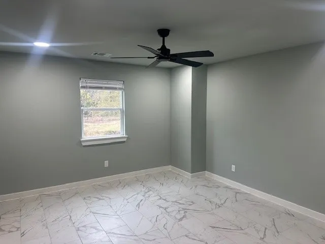 a view of a hallway with a window