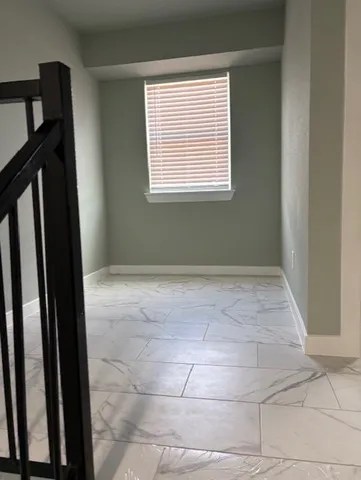 a view of a room with a window