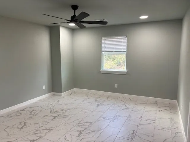 a view of an empty room and a window