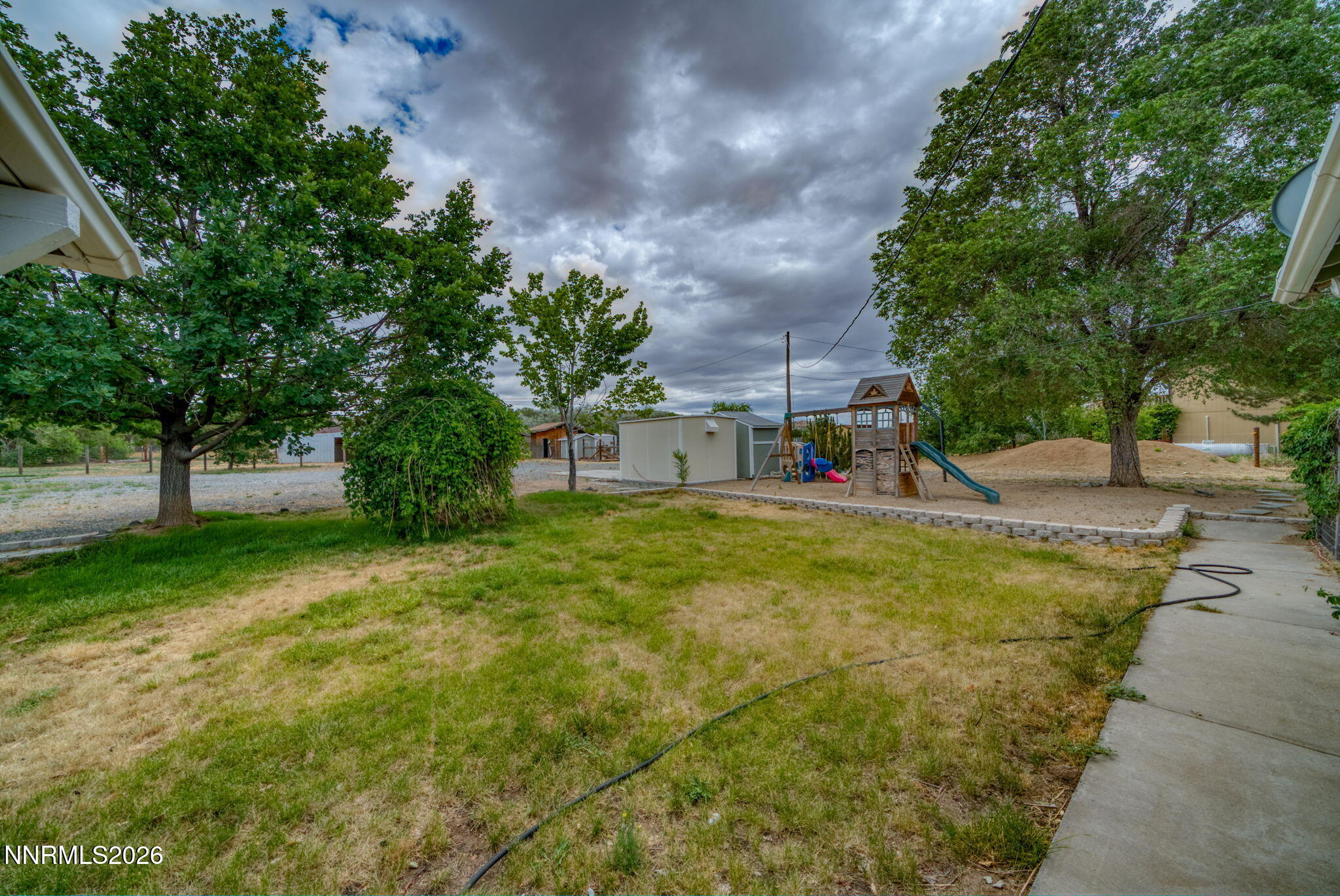 11577 Deodar Way Reno, NV 89506 - Photo 55 of 58 a swimming pool with outdoor seating and yard