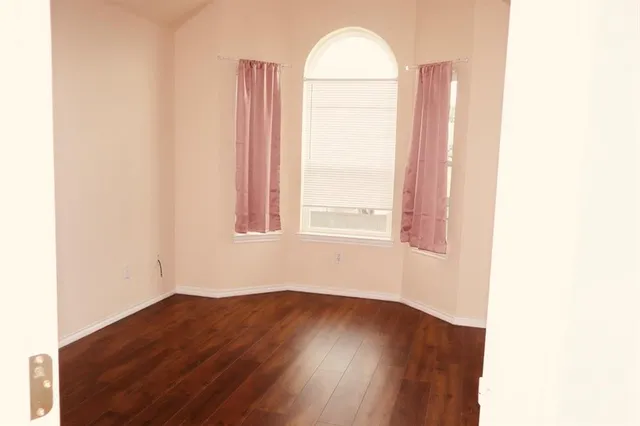 a view of a room that has a window in it