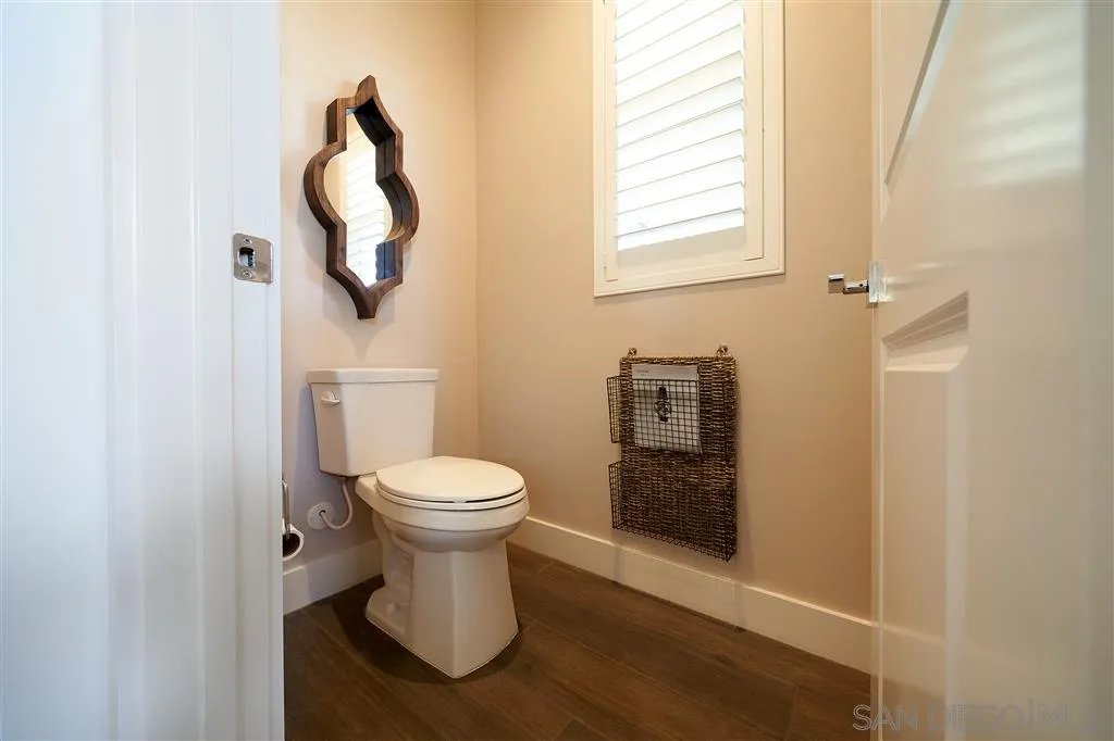 672 Polaris Drive Encinitas, CA 92024 - Photo 13 of 26 a bathroom with a toilet and a mirror