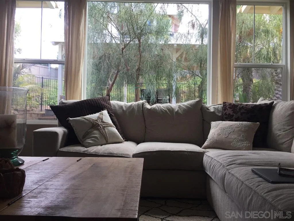 672 Polaris Drive Encinitas, CA 92024 - Photo 18 of 26 a living room with furniture and a large window