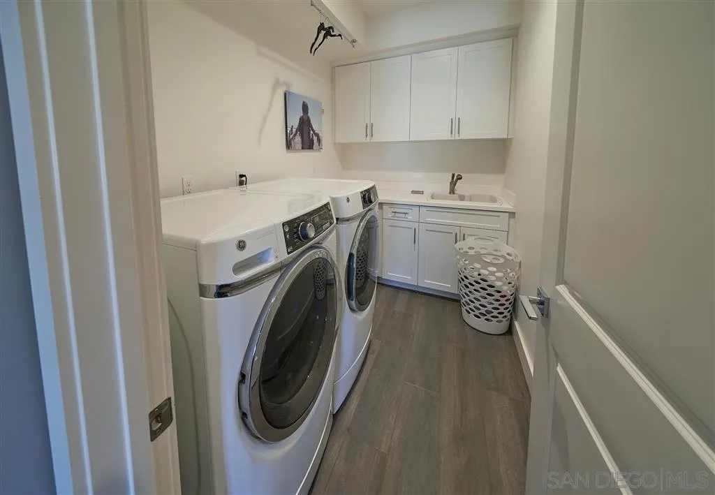 672 Polaris Drive Encinitas, CA 92024 - Photo 20 of 26 a utility room with sink dryer and washer