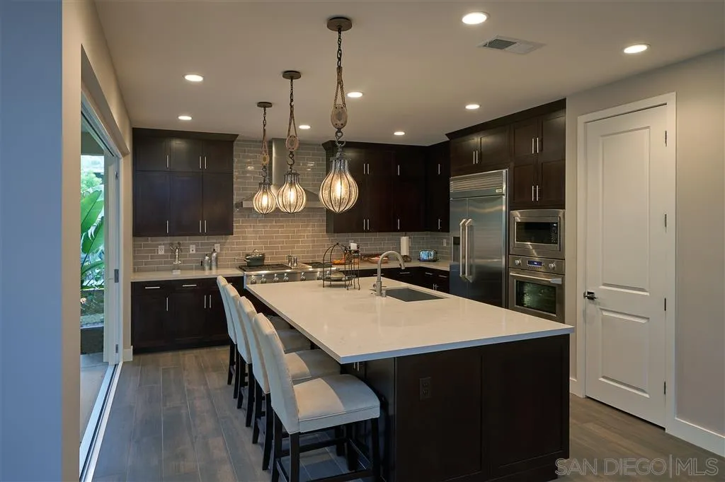 672 Polaris Drive Encinitas, CA 92024 - Photo 6 of 26 a kitchen with a table and chairs in it