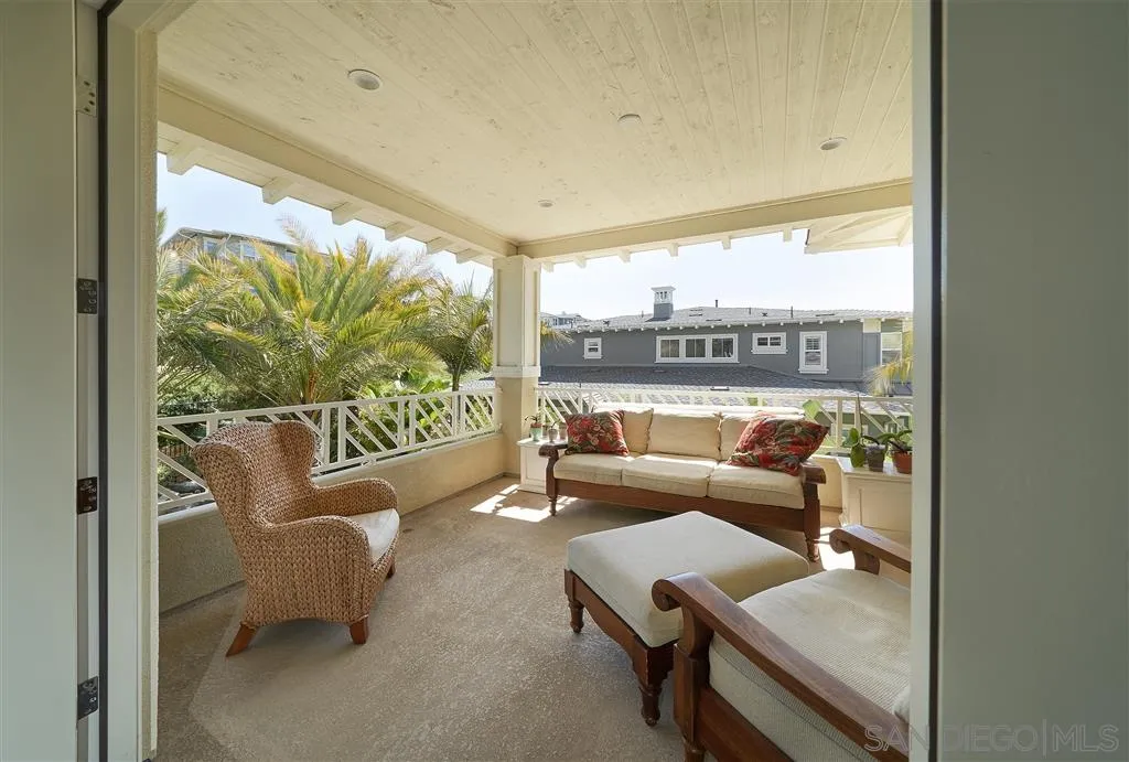 672 Polaris Drive Encinitas, CA 92024 - Photo 10 of 26 a living room with patio furniture and a floor to ceiling window