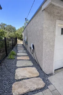 a view of a backyard with pathway