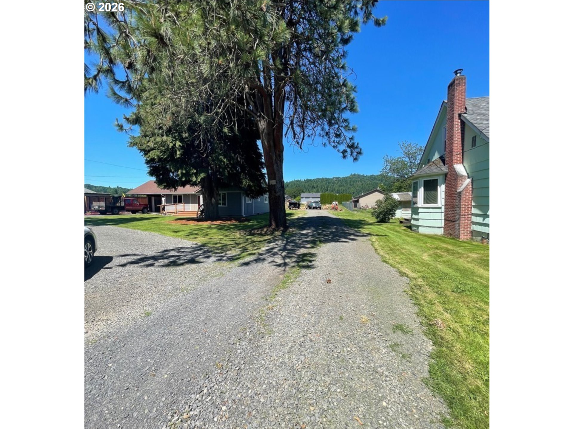 4332 Ohio Street Longview, WA 98632 - Photo 3 of 5 a view of a street with a building and trees in the background
