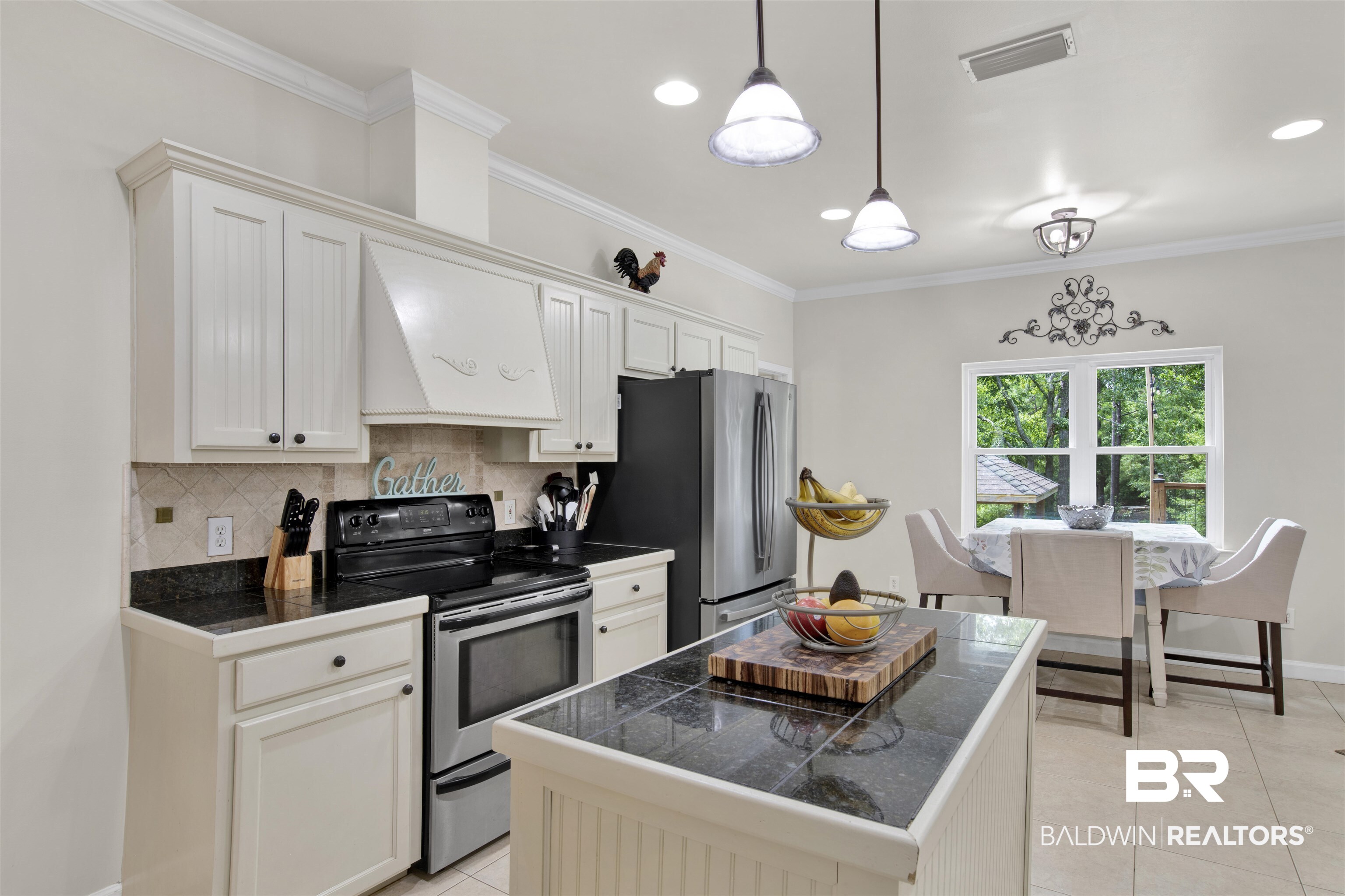 638 Southern Way Daphne, AL 36527 - Photo 9 of 26 Kitchen with electric range, light tile patterned floors, premium range hood, decorative backsplash, and decorative light fixtures