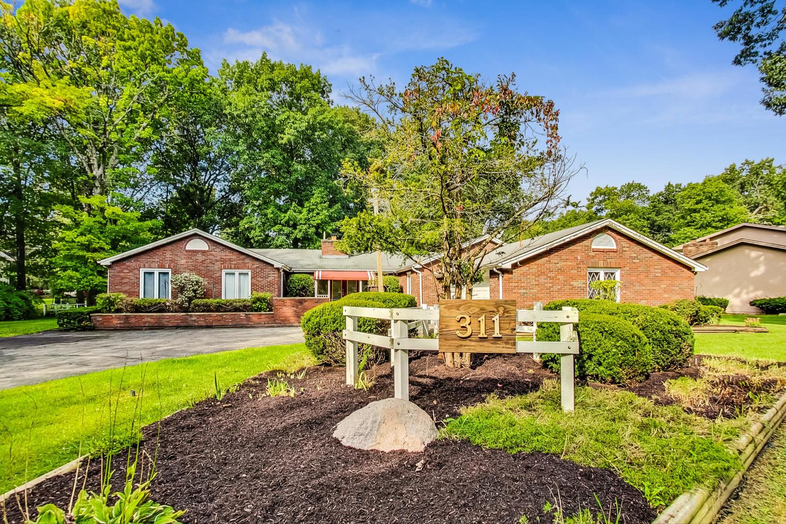 311 Deerpath Drive Winthrop Harbor, IL 60096 - Photo 1 of 48 a front view of a house with garden