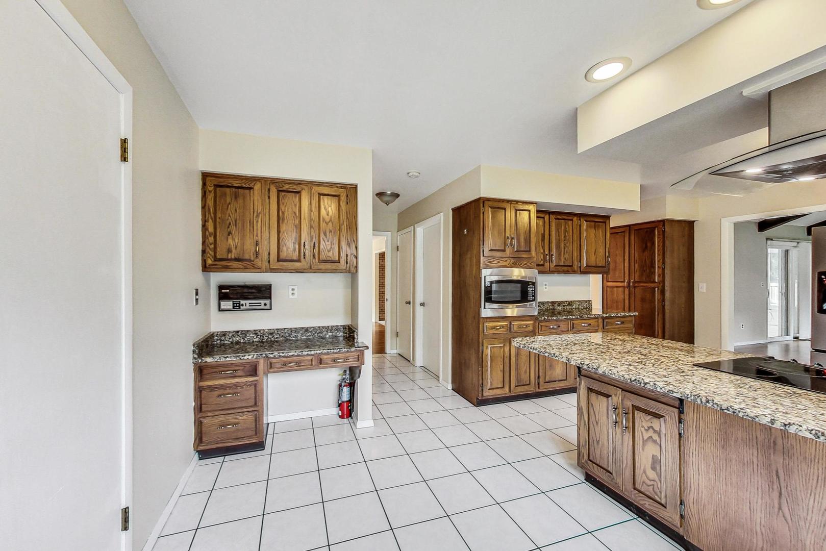 311 Deerpath Drive Winthrop Harbor, IL 60096 - Photo 14 of 48 a kitchen with stainless steel appliances a stove sink and cabinets