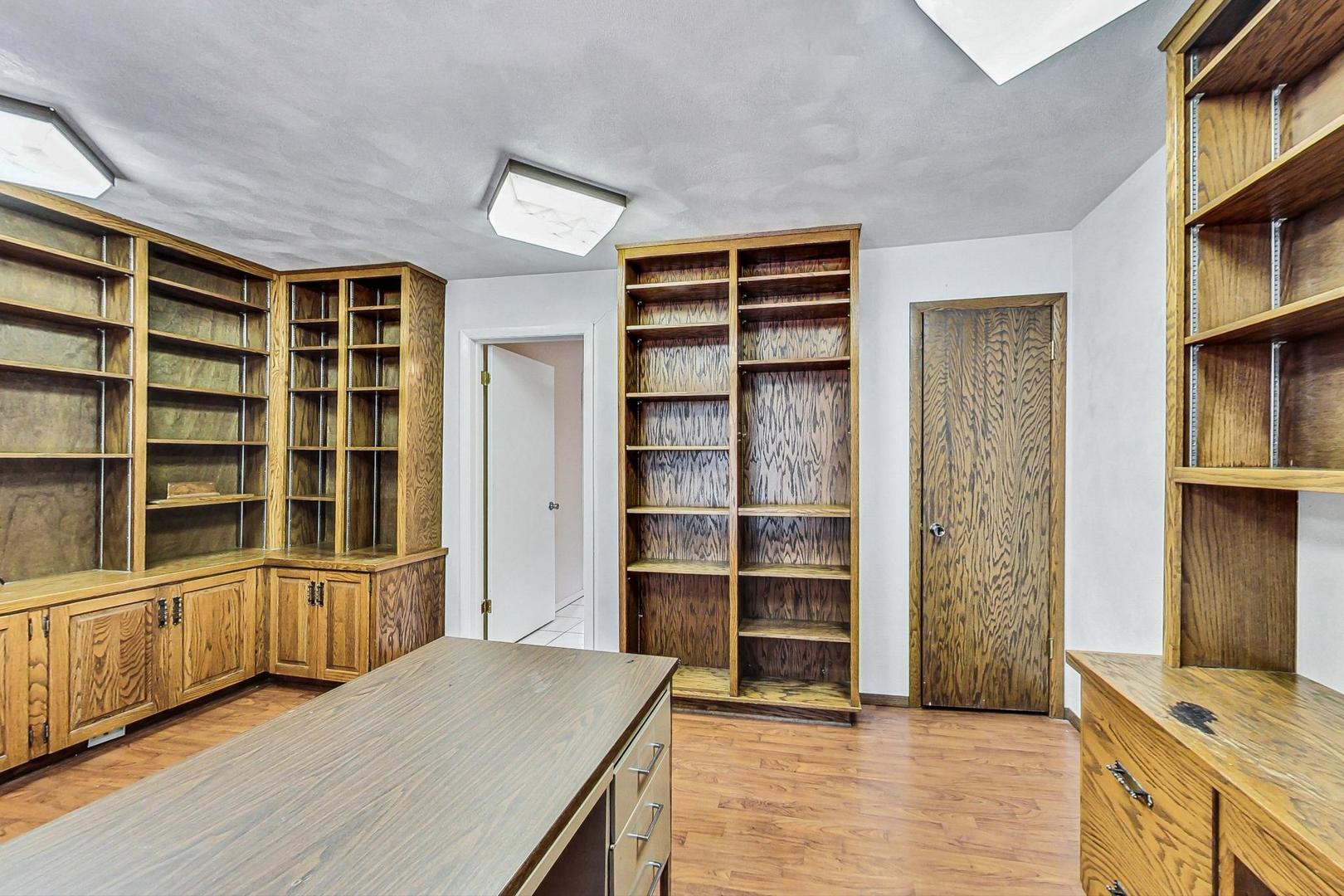 311 Deerpath Drive Winthrop Harbor, IL 60096 - Photo 17 of 48 a view of wooden floor and windows in a room