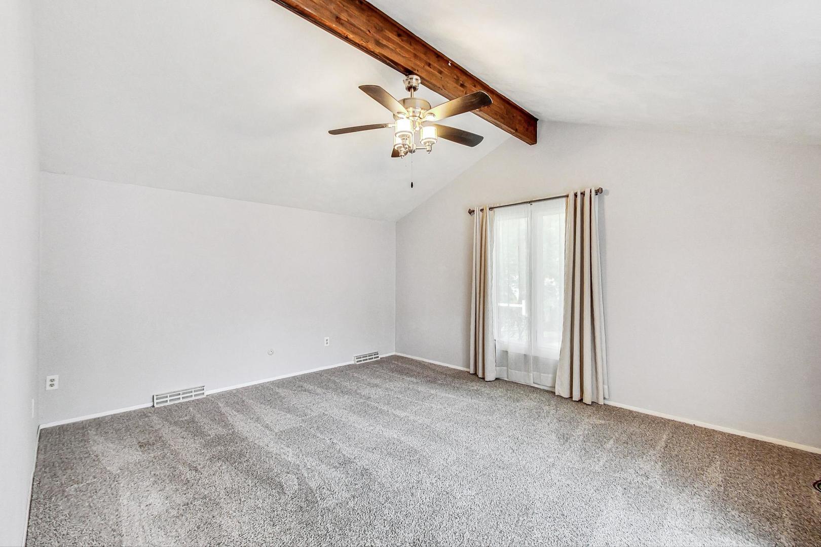 311 Deerpath Drive Winthrop Harbor, IL 60096 - Photo 19 of 48 an empty room with fan and windows