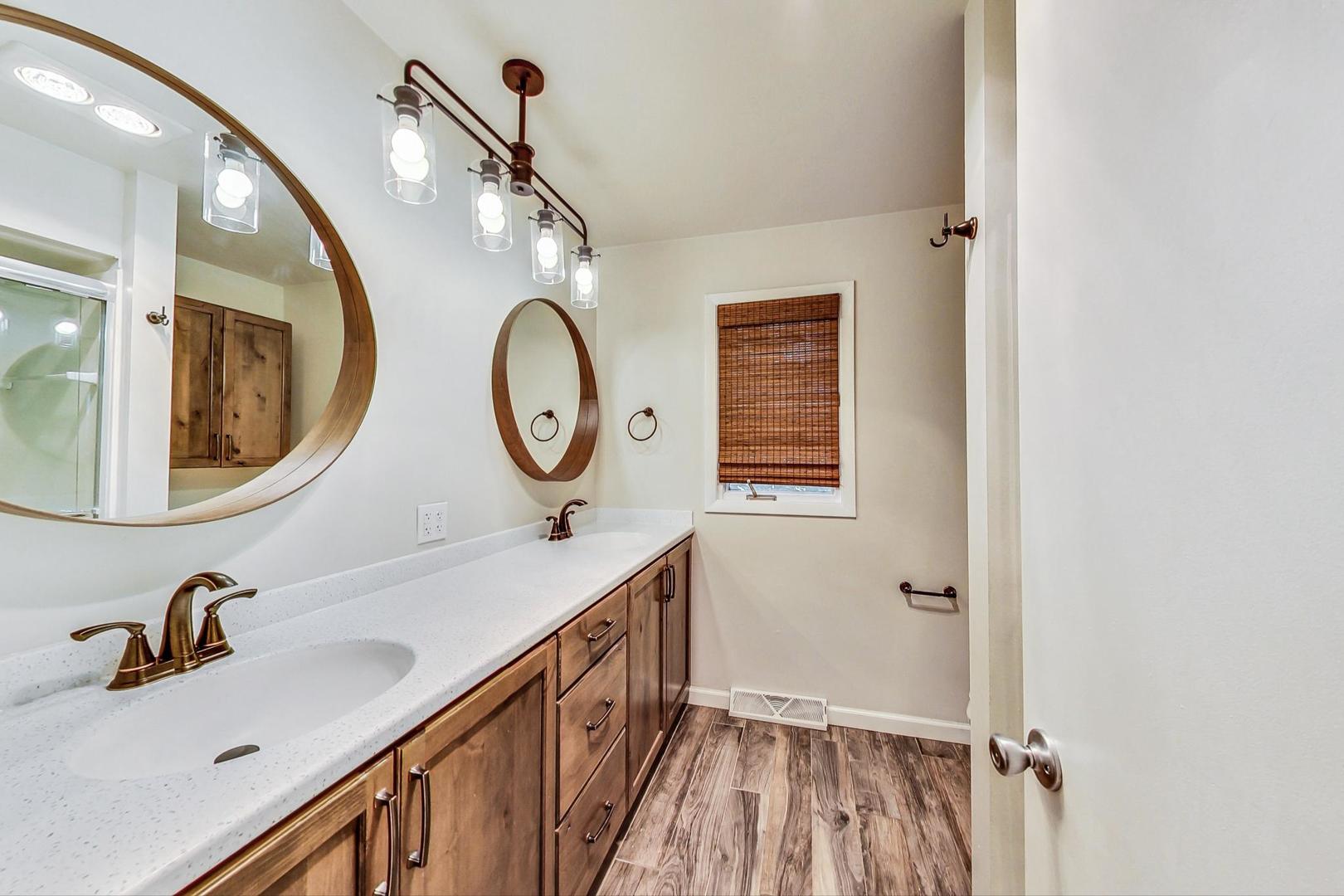 311 Deerpath Drive Winthrop Harbor, IL 60096 - Photo 30 of 48 a bathroom with a sink and a mirror