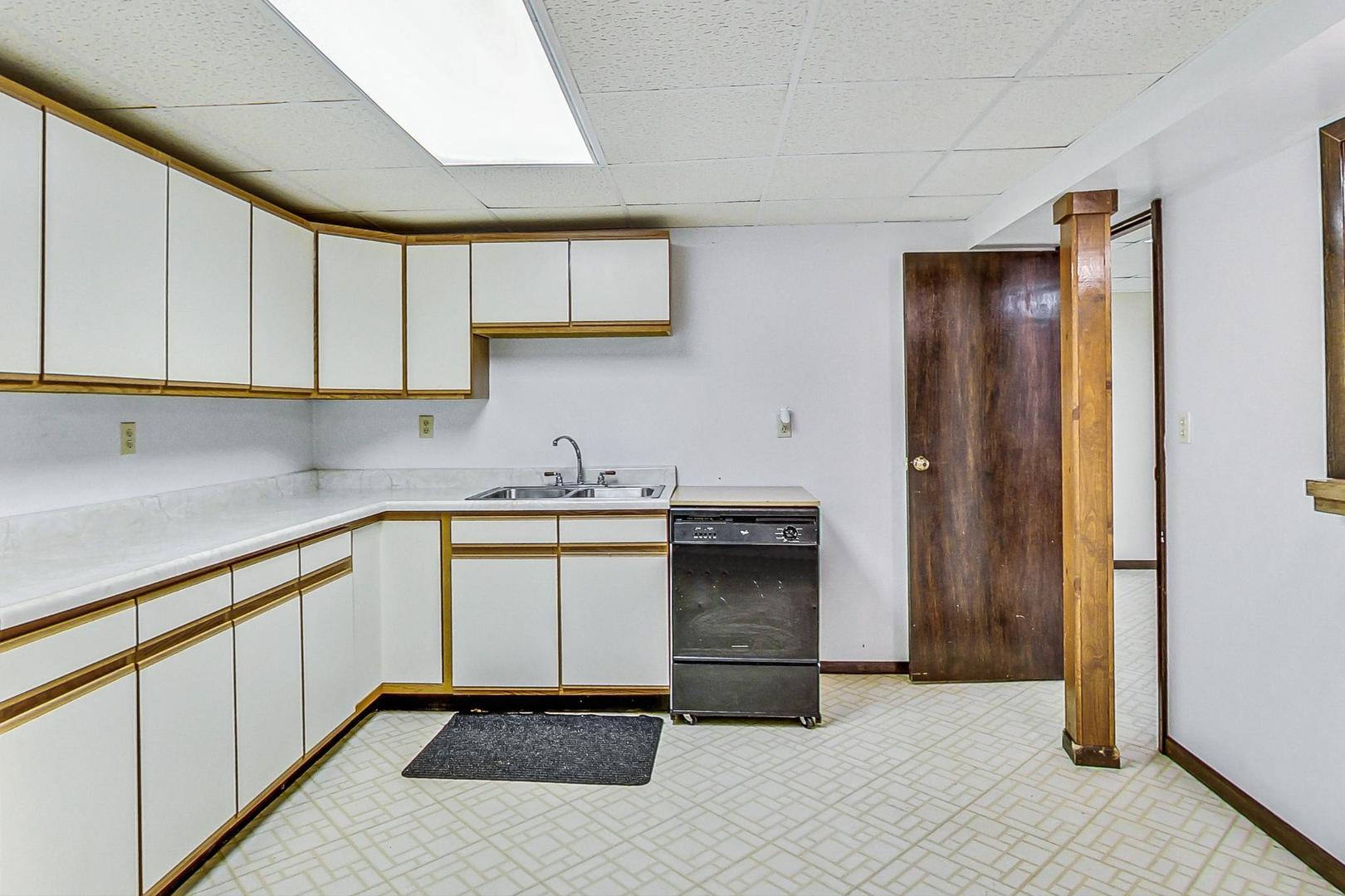 311 Deerpath Drive Winthrop Harbor, IL 60096 - Photo 37 of 48 a kitchen with a sink and cabinets