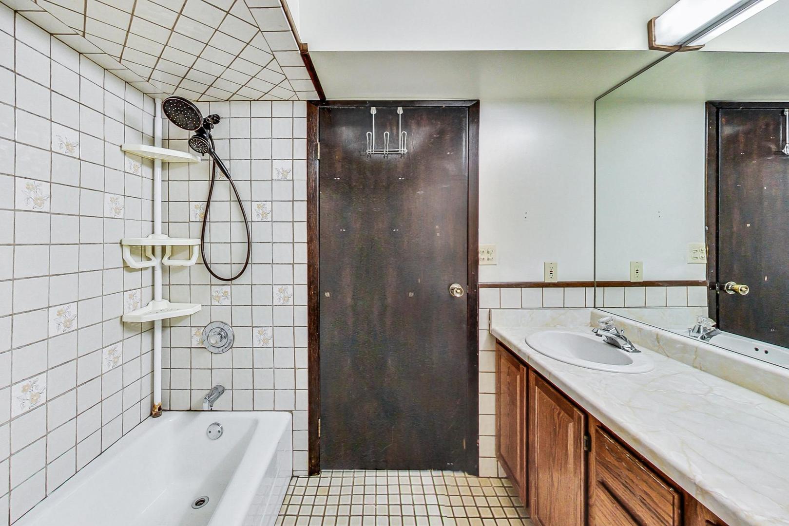 311 Deerpath Drive Winthrop Harbor, IL 60096 - Photo 38 of 48 a bathroom with a sink a toilet and shower