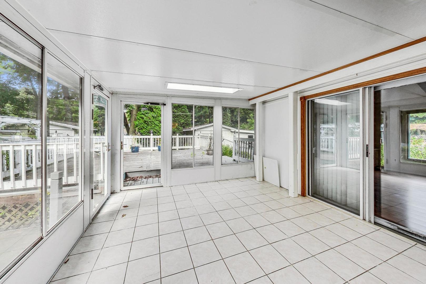 311 Deerpath Drive Winthrop Harbor, IL 60096 - Photo 39 of 48 a spacious bedroom with a large bed and a large window