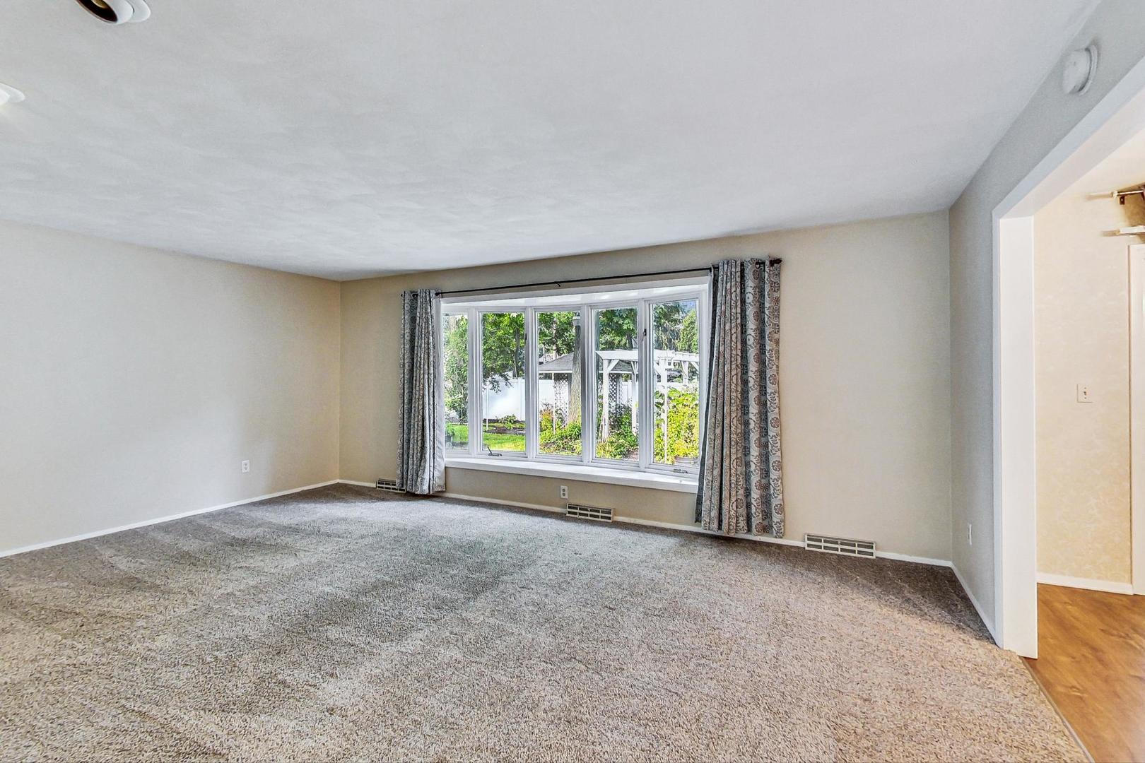 311 Deerpath Drive Winthrop Harbor, IL 60096 - Photo 6 of 48 a view of an empty room with a window