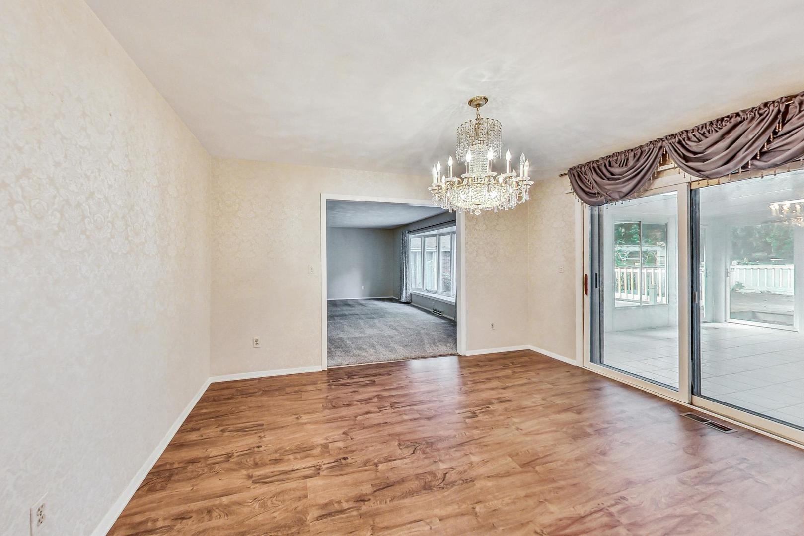 311 Deerpath Drive Winthrop Harbor, IL 60096 - Photo 8 of 48 a view of an empty room with a chandelier