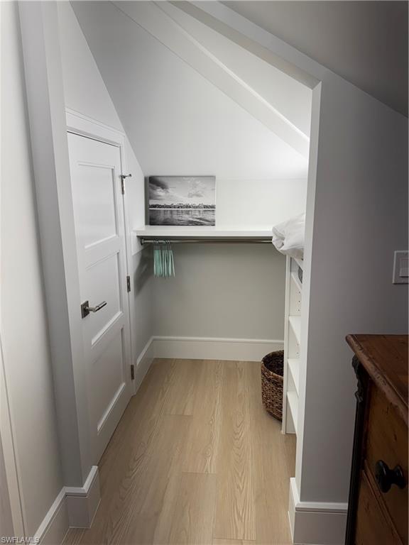 787 4th Avenue South Naples, FL 34102 - Photo 12 of 15 Spacious closet with light hardwood / wood-style floors and lofted ceiling