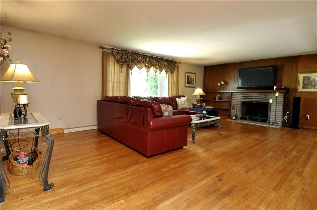 600 Ravencrest Road Pittsburgh, PA 15215 - Photo 9 of 21 Large living room, with gas fireplace. Hardwood floors.