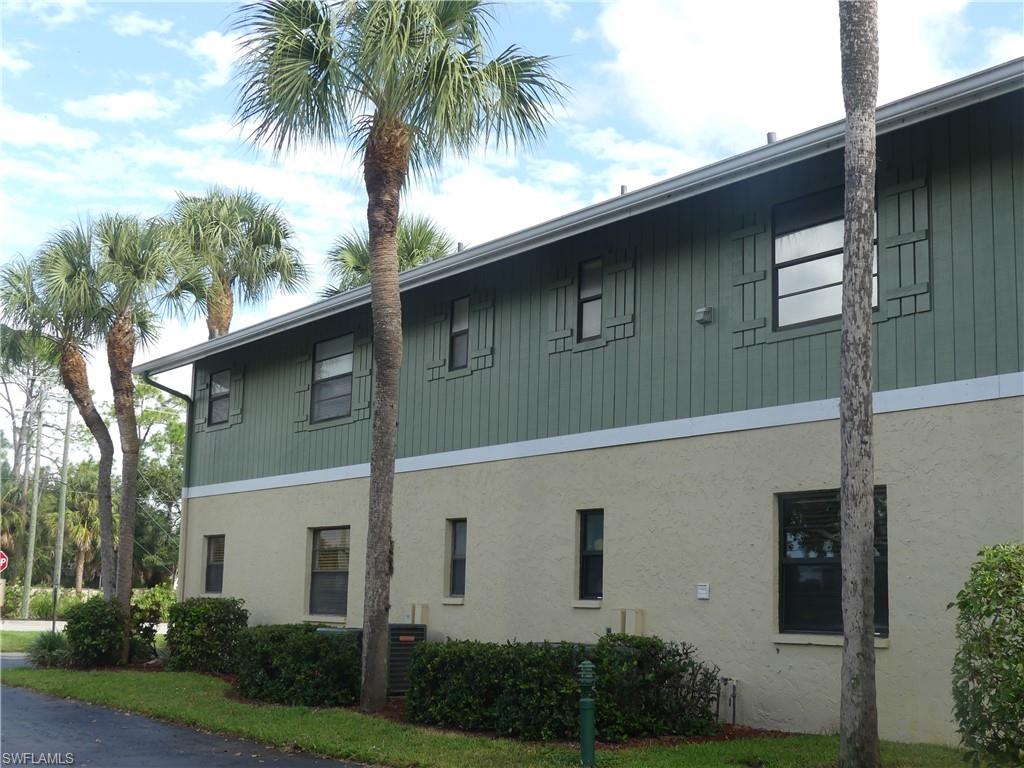 5501 Rattlesnake Hammock Road, Unit 1002 Naples, FL 34113 - Photo 8 of 9 a house with a tree in the background