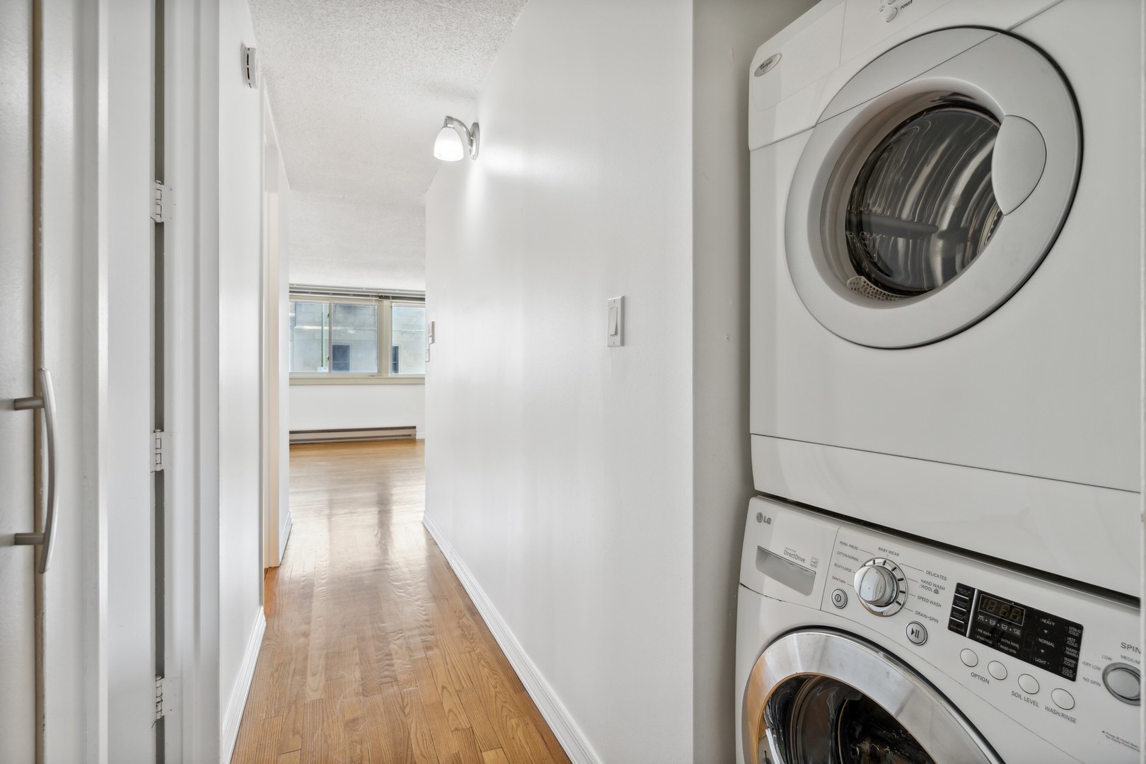 4900 North Lester Avenue, Unit 5 Chicago, IL 60630 - Photo 14 of 18 a view of a hallway with washer and dryer