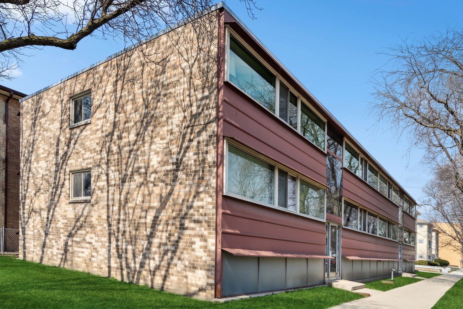 4900 North Lester Avenue, Unit 5 Chicago, IL 60630 - Photo 15 of 18 a view of a building with a yard