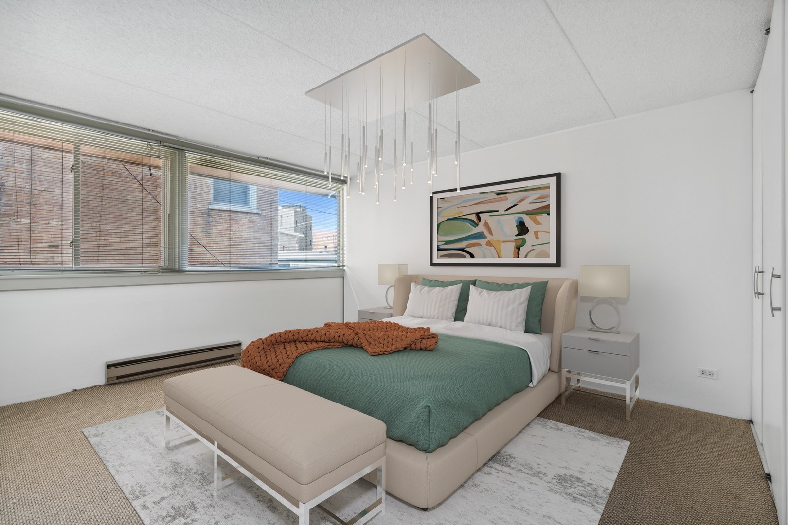 4900 North Lester Avenue, Unit 5 Chicago, IL 60630 - Photo 8 of 18 a bedroom with a large bed and a painting on the wall