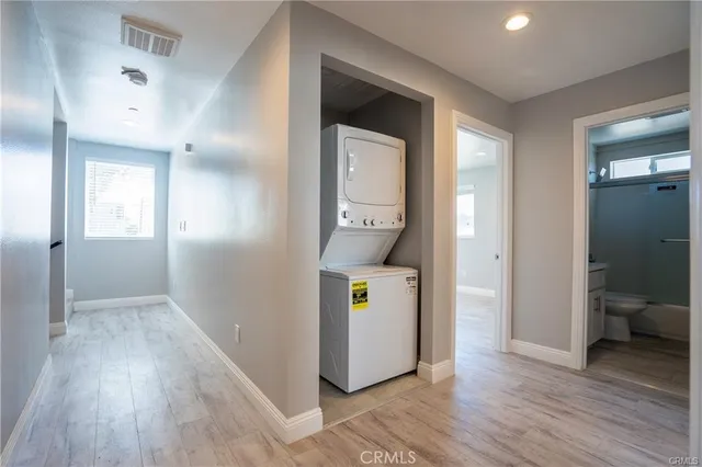 wooden floor in an empty room and a mirror