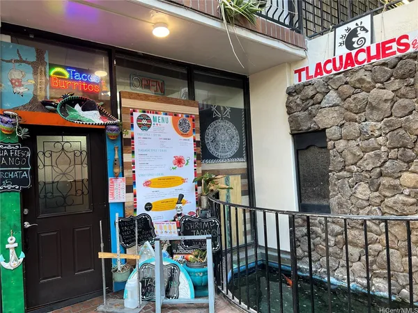 a view of a porch with furniture and a yard