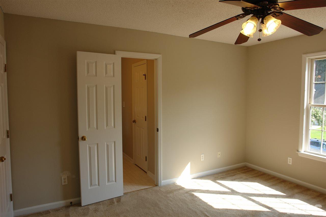 8317 Neuse Rapids Road Raleigh, NC 27616 - Photo 14 of 25 View of the Master. Window (on right) looks out onto the street/cul-de-sac area. Door (on left) is the Master Bath with walk-in-closet.