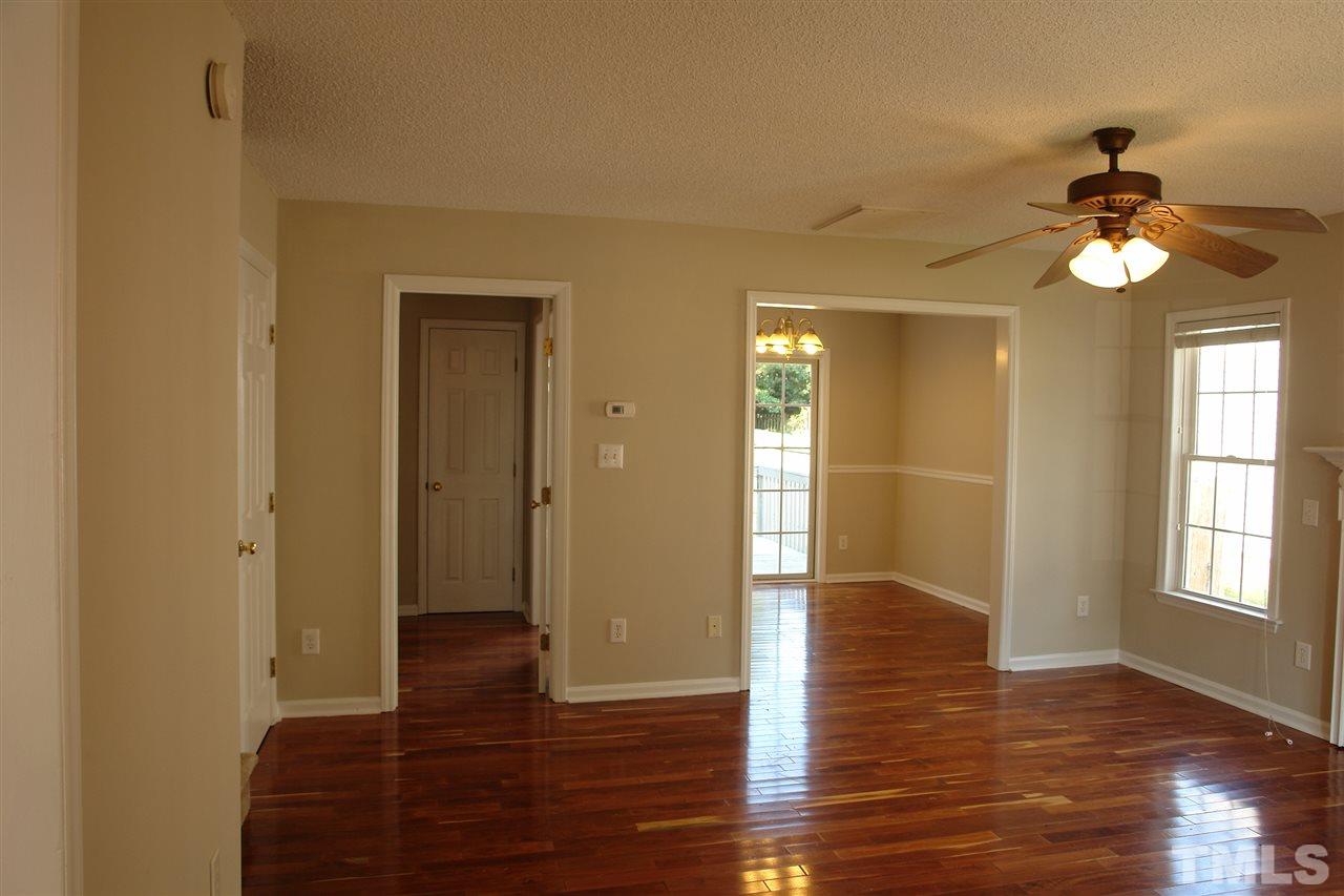8317 Neuse Rapids Road Raleigh, NC 27616 - Photo 5 of 25 View from the entryway looking toward the Living Room (w/fireplace) and into Dining Room. The doorway to the left leads to Kitchen.