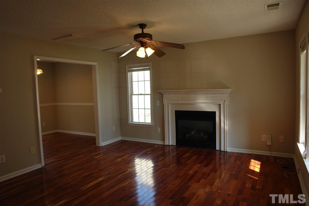 8317 Neuse Rapids Road Raleigh, NC 27616 - Photo 6 of 25 Lots of beautiful light in this home and the Living Room. The wood floors are beautiful.