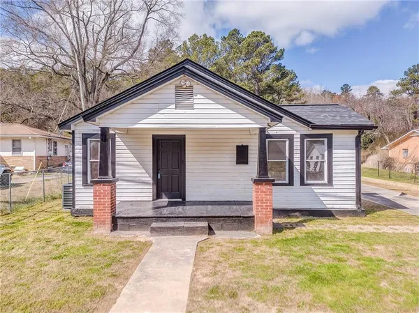 a front view of a house with a yard