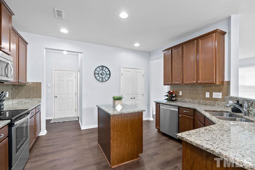 3518 Winding Walk Court Raleigh, NC 27616 - Photo 14 of 46 Counter space and cabinets galore