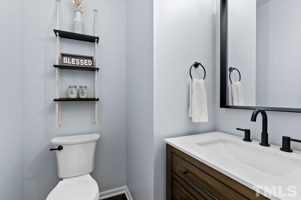 3518 Winding Walk Court Raleigh, NC 27616 - Photo 18 of 46 Stylish half bath off the mudroom