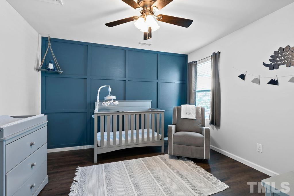 3518 Winding Walk Court Raleigh, NC 27616 - Photo 21 of 46 Bedroom 2 showcases this beautiful wall detail, new flooring, and a large walk-in-closet