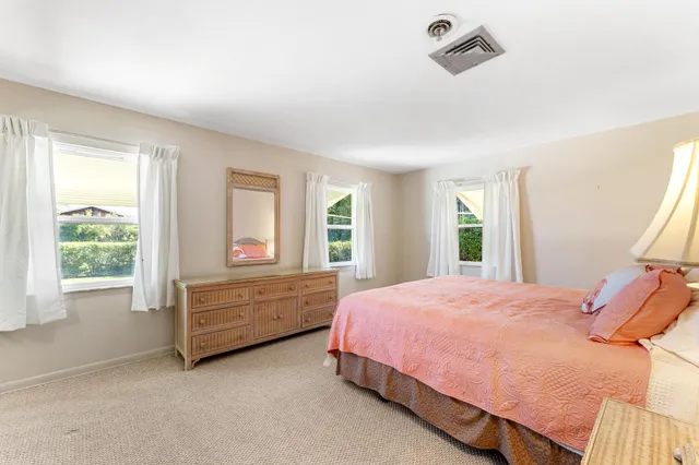 a bed room with a bed and a window