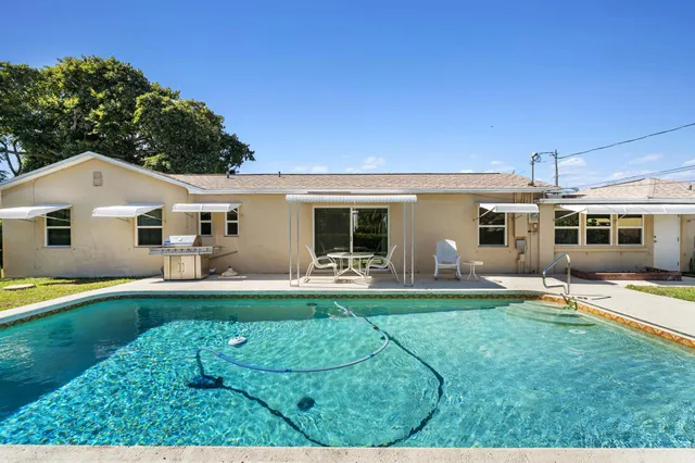 a front view of a house with a yard and porch