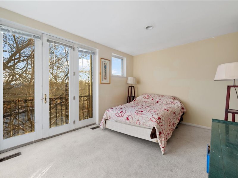 1412 West Diversey Parkway, Unit B Chicago, IL 60614 - Photo 13 of 26 a bedroom with a bed and large window