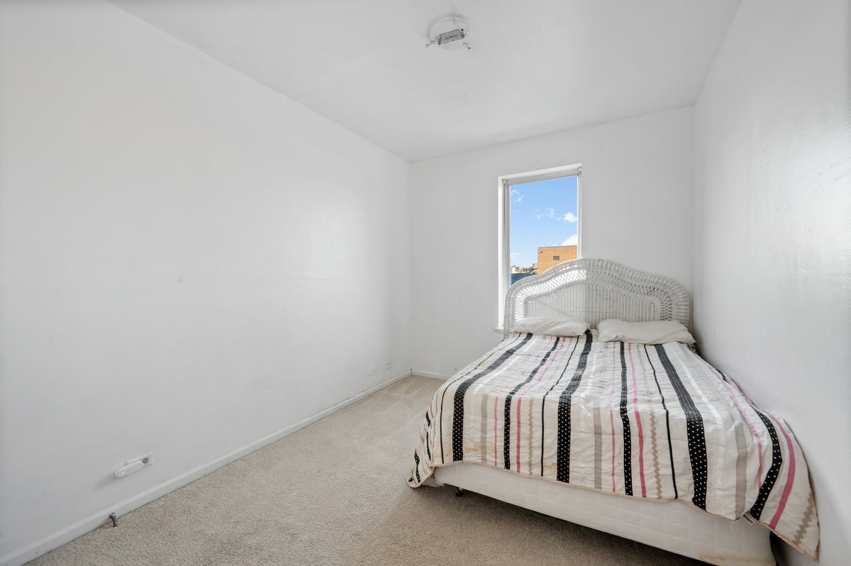 1412 West Diversey Parkway, Unit B Chicago, IL 60614 - Photo 17 of 26 a bedroom with a bed and window