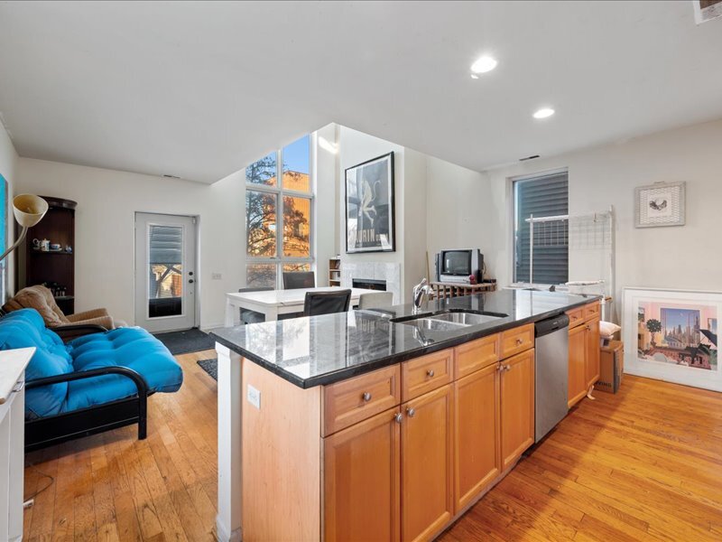 1412 West Diversey Parkway, Unit B Chicago, IL 60614 - Photo 2 of 26 a kitchen with stainless steel appliances granite countertop a sink and a refrigerator