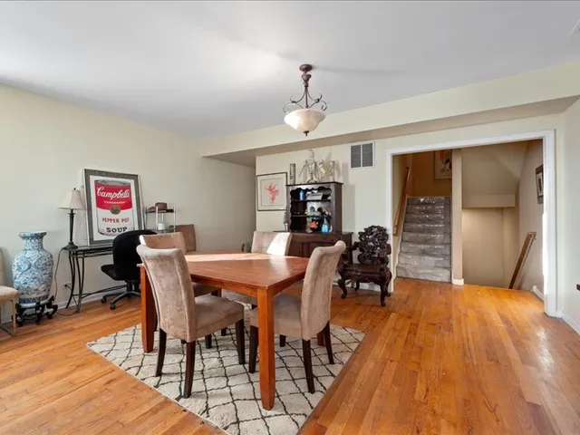 a living room with furniture rug and a large window